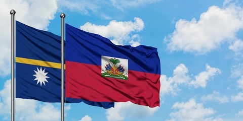 Nauru and Haiti flag waving in the wind against white cloudy blue sky together. Diplomacy concept, international relations.