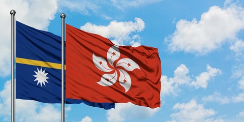 Nauru and Hong Kong flag waving in the wind against white cloudy blue sky together. Diplomacy concept, international relations.