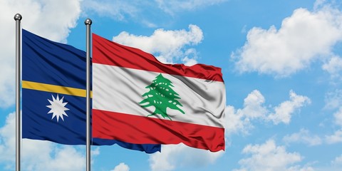 Nauru and Lebanon flag waving in the wind against white cloudy blue sky together. Diplomacy concept, international relations.