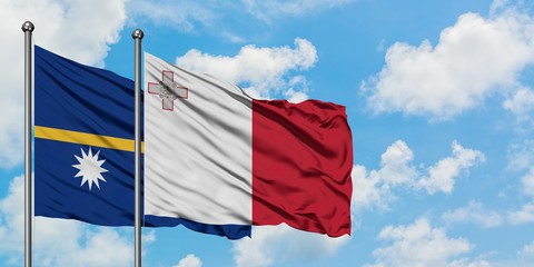 Nauru and Malta flag waving in the wind against white cloudy blue sky together. Diplomacy concept,...