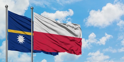 Nauru and Poland flag waving in the wind against white cloudy blue sky together. Diplomacy concept, international relations.