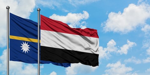 Nauru and Yemen flag waving in the wind against white cloudy blue sky together. Diplomacy concept, international relations.