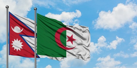 Nepal and Algeria flag waving in the wind against white cloudy blue sky together. Diplomacy concept, international relations.