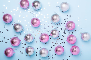 Christmas composition Pink, silver balls and sparkles on pastel blue background. Christmas, winter, new year concept. Flat lay, top view, copy space - Image