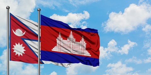 Nepal and Cambodia flag waving in the wind against white cloudy blue sky together. Diplomacy concept, international relations.