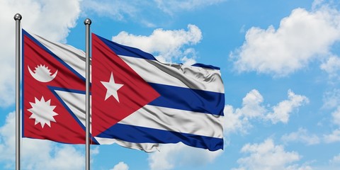 Nepal and Cuba flag waving in the wind against white cloudy blue sky together. Diplomacy concept, international relations.