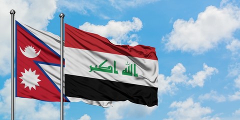 Nepal and Iraq flag waving in the wind against white cloudy blue sky together. Diplomacy concept, international relations.