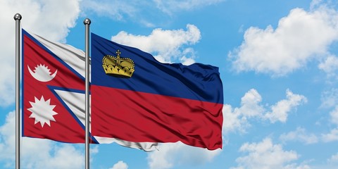 Nepal and Liechtenstein flag waving in the wind against white cloudy blue sky together. Diplomacy concept, international relations.