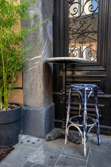 old bar chair and coffee table on the street under the tree