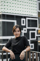 Portrait of seriously asian woman in the city