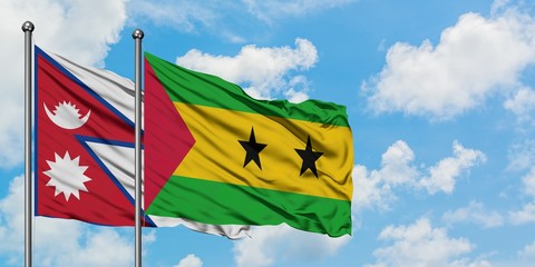 Nepal and Sao Tome And Principe flag waving in the wind against white cloudy blue sky together. Diplomacy concept, international relations.
