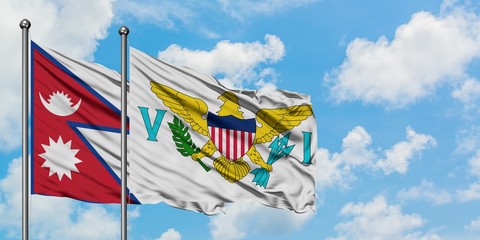 Nepal and United States Virgin Islands flag waving in the wind against white cloudy blue sky together. Diplomacy concept, international relations.