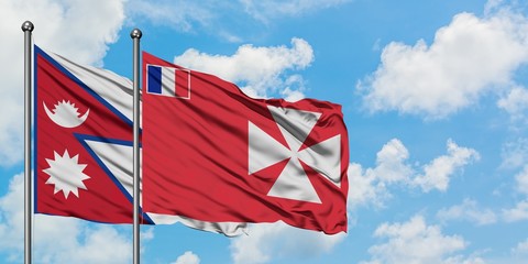 Nepal and Wallis And Futuna flag waving in the wind against white cloudy blue sky together....
