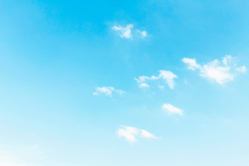 Fluffy white clouds flying on blue sky background