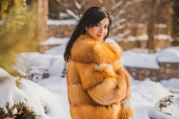 Vogue concept. Beautiful arabic lady in holidays, modern woman wear fur coat look . Fashionable...