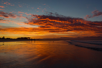 Fototapeta na wymiar beach in nelson during a breathtaking sunset on Tahunanui Beach at Nelson, New Zealand