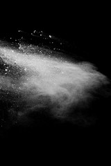 Explosion of colored powder isolated on black background. Abstract colored background. holi festival.