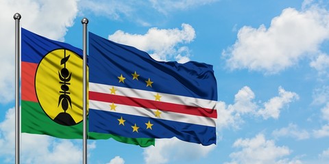 New Caledonia and Cape Verde flag waving in the wind against white cloudy blue sky together. Diplomacy concept, international relations.