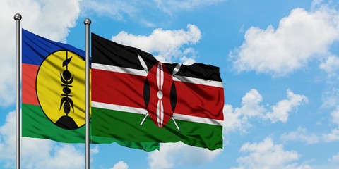 New Caledonia and Kenya flag waving in the wind against white cloudy blue sky together. Diplomacy concept, international relations.