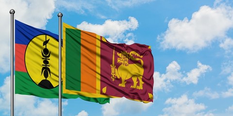 New Caledonia and Sri Lanka flag waving in the wind against white cloudy blue sky together. Diplomacy concept, international relations.