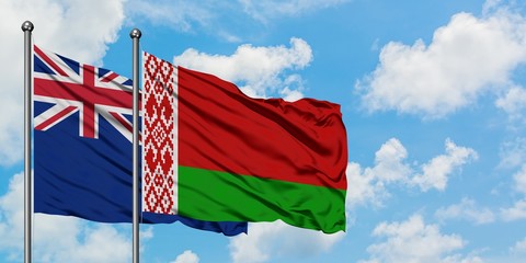 New Zealand and Belarus flag waving in the wind against white cloudy blue sky together. Diplomacy concept, international relations.