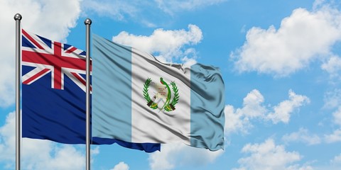 New Zealand and Guatemala flag waving in the wind against white cloudy blue sky together. Diplomacy concept, international relations.