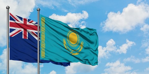 New Zealand and Kazakhstan flag waving in the wind against white cloudy blue sky together. Diplomacy concept, international relations.