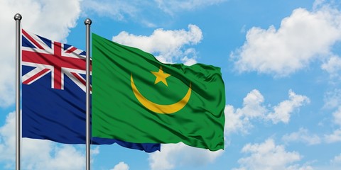 New Zealand and Mauritania flag waving in the wind against white cloudy blue sky together. Diplomacy concept, international relations.