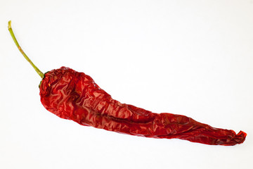 Dried hot pepper on a white background.