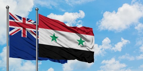 New Zealand and Syria flag waving in the wind against white cloudy blue sky together. Diplomacy concept, international relations.