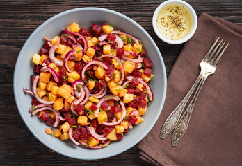 Potato and beetroot salad with olive oil dressing, vegetarian cuisine.