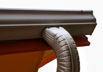 White Roof Gutter on an Orange House