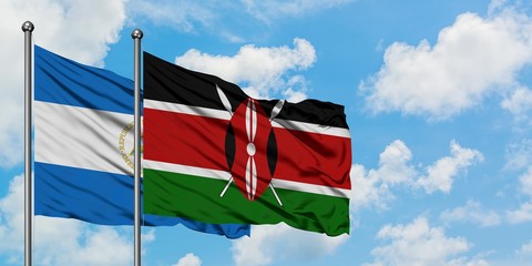 Nicaragua and Kenya flag waving in the wind against white cloudy blue sky together. Diplomacy concept, international relations.