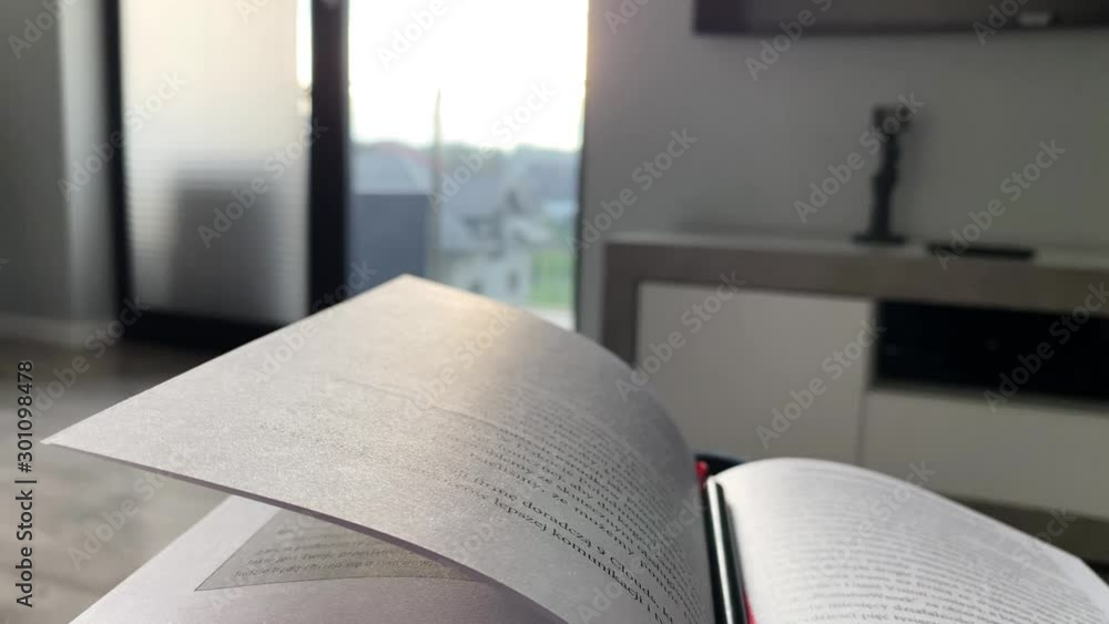 Poster open book on the background of bright window window window, large glass surface and falling rays of 