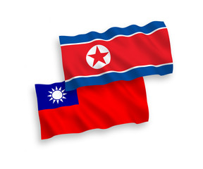 National vector fabric wave flags of North Korea and Taiwan isolated on white background. 1 to 2 proportion.