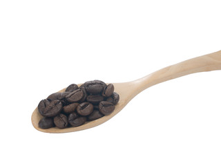 Pile Roasted brown coffee beans on woods spoon isolated on white background.close up