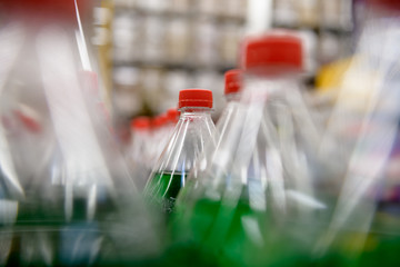 Transparent plastic bottles with a carbonated drink on the conveyor