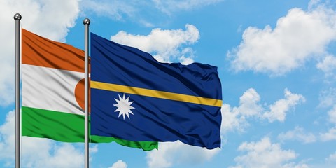 Niger and Nauru flag waving in the wind against white cloudy blue sky together. Diplomacy concept,...