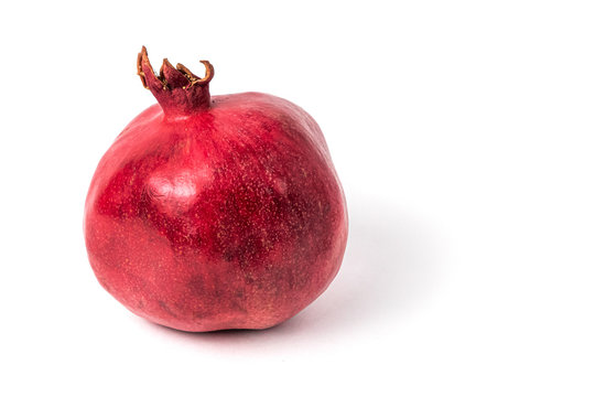 Closeup of pomegranate on white background. Isolated.