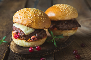 Big burger with cheese and cranberry sauce