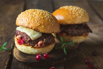 Big burger with cheese and cranberry sauce