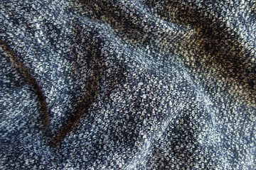 Blue grey melange woolen fabric in soft folds