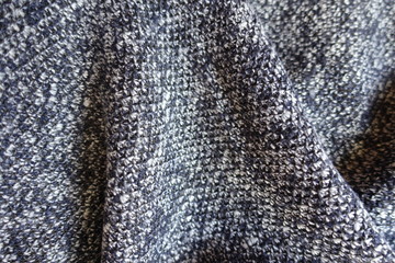 Folded blue grey melange woolen fabric from above
