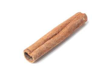 Closeup of cinnamon stick, isolated on white background. Shallow  DOF.