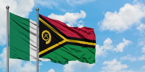 Nigeria and Vanuatu flag waving in the wind against white cloudy blue sky together. Diplomacy concept, international relations.