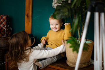 Cozy funny siblings together in kitchen,Christmas