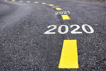 Number of 2019 to 2023 on asphalt road surface with marking lines, happy new year concept