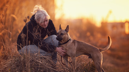 Woman with a dog, Thai Ridgeback