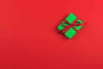 Gift box with ribbon and bow on color background and space for text. Top view - Image