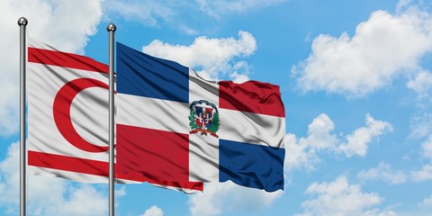 Northern Cyprus and Dominican Republic flag waving in the wind against white cloudy blue sky together. Diplomacy concept, international relations.